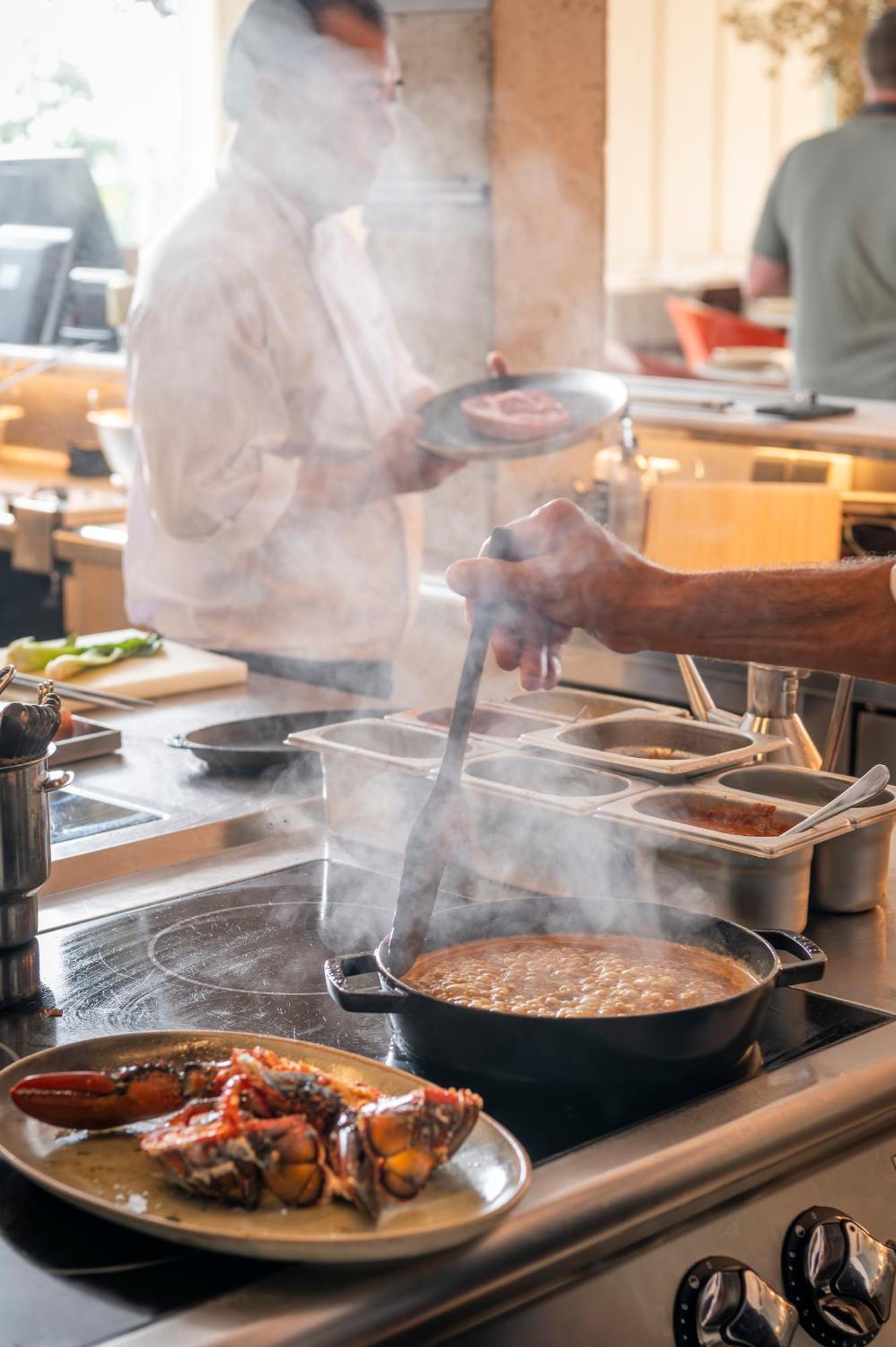 Atzavara Hotel & Spa Санта-Сусанна Экстерьер фото A chef stirring a pot of soup